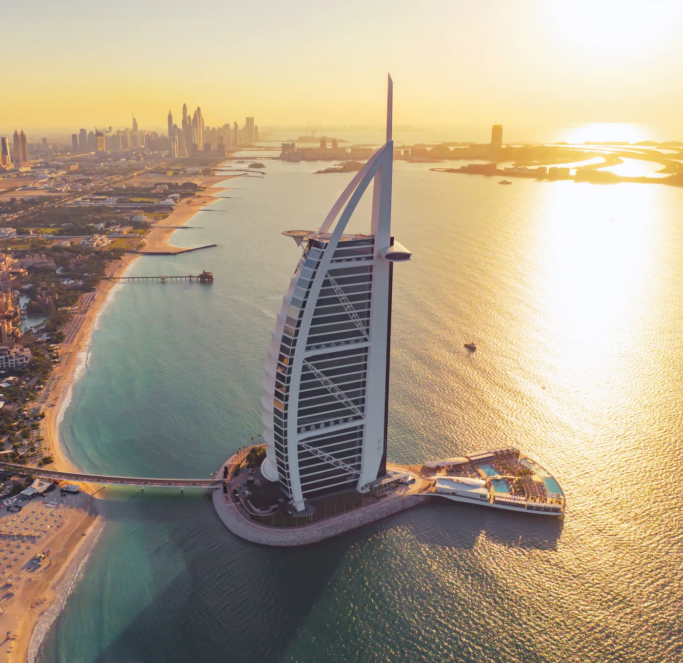 Burj Al Arab and the Dubai coastline at sunset