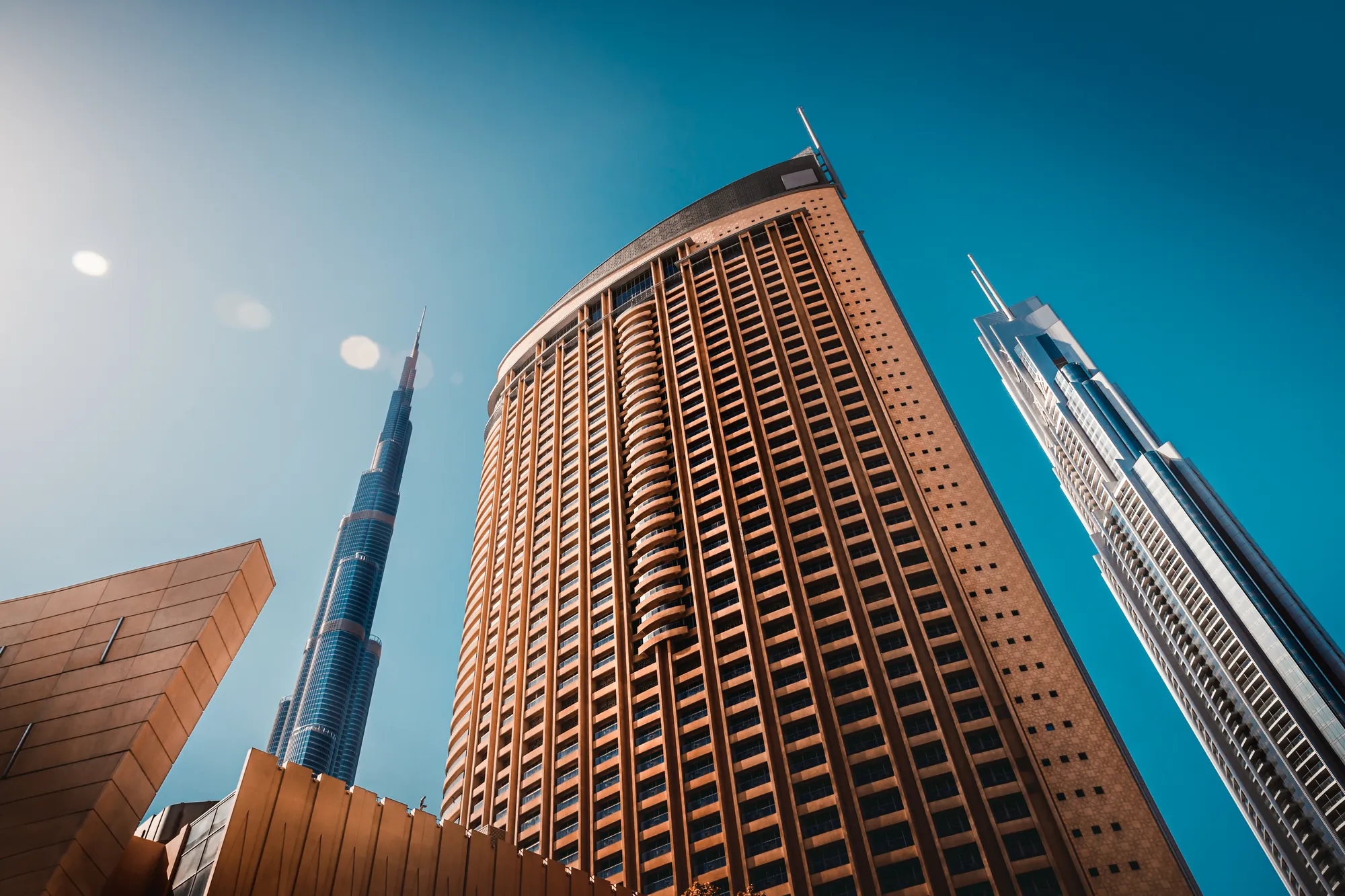 Burj Khalifa and Downtown Dubai towers against a clear sky